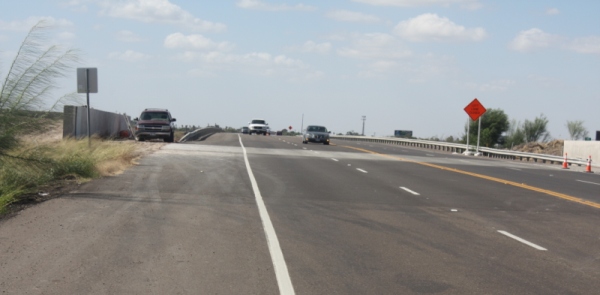 Raise Levees Without Raising Bridges