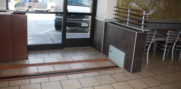 FloodBreak passive flood barriers provide permanent flood protection while blending with restaurant tile flooring.