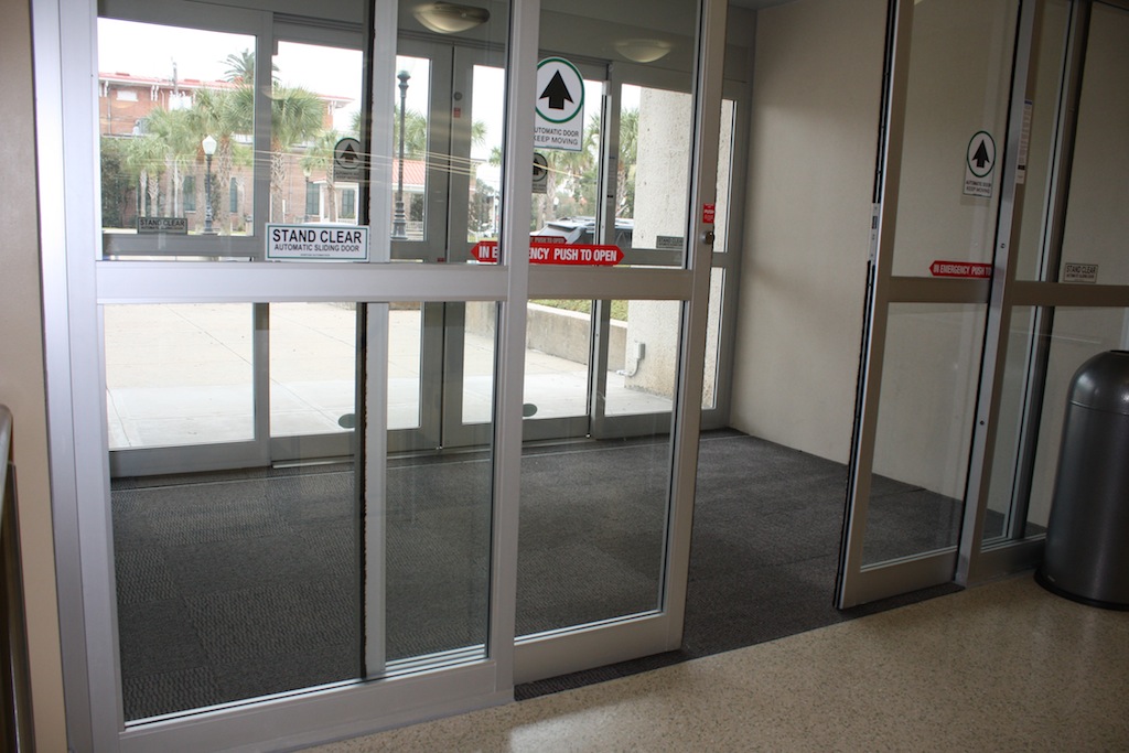 Rosenberg Library_south entrance_ polished concrete wiper walls and carpet covering