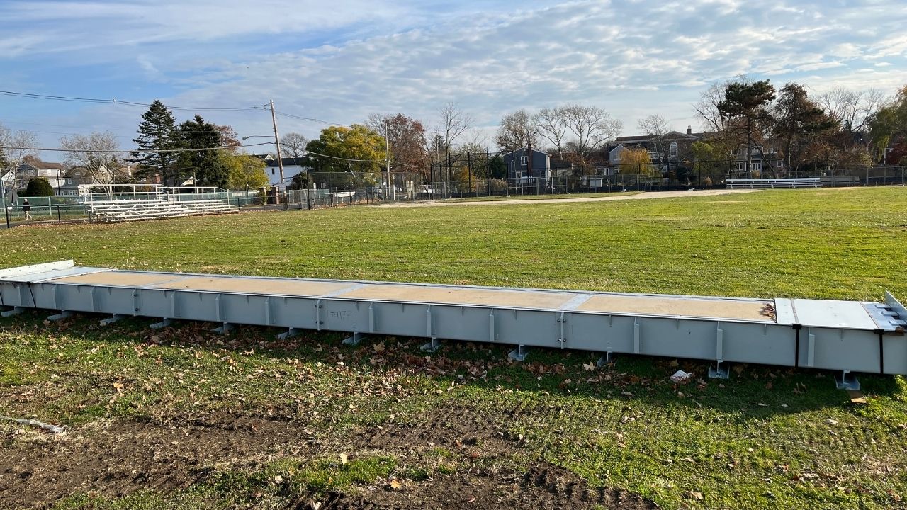 flood barrier on baseball field