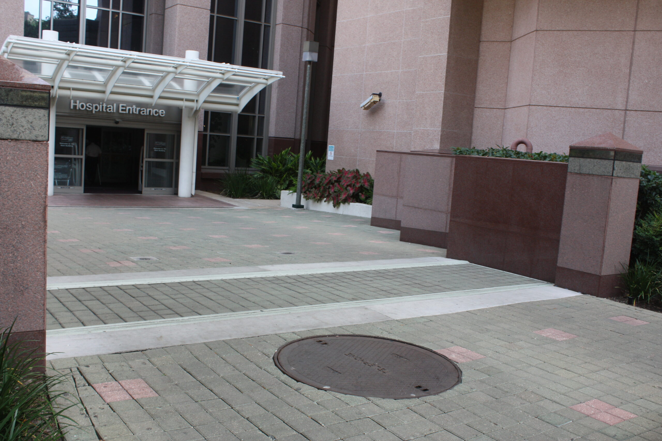 MD Anderson Cancer Center entrance pedestrian gate covered by pavers