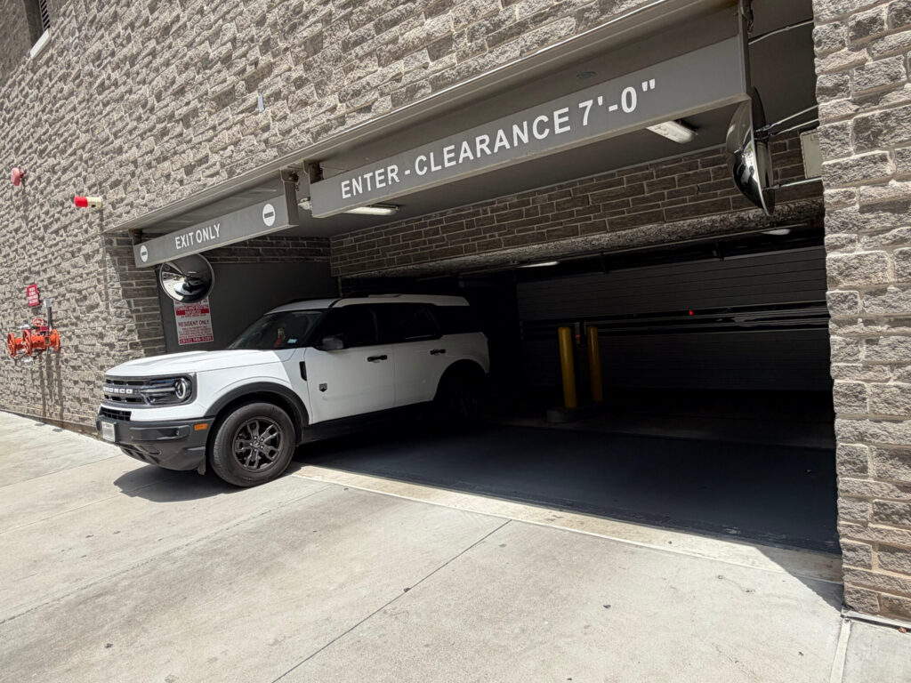 Car over 5th and west blurred license
